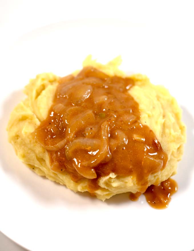 A good serving of creamy Southern Onion Gravy with mashed potatoes.