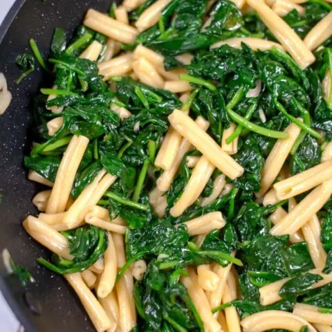 Closeup on the fresh Spinach in Casarecce pasta.