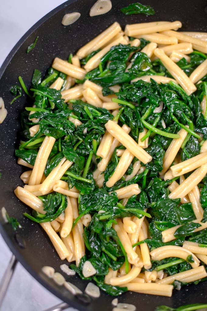 Closeup on the fresh Spinach in Casarecce pasta.