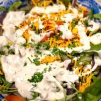 Lots of Keto Ranch Dressing over a salad.