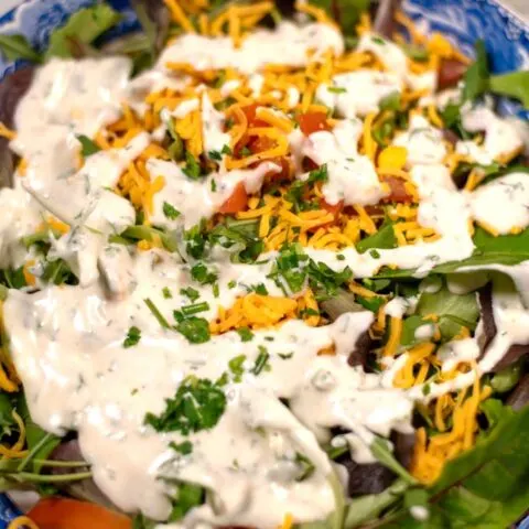 Lots of Keto Ranch Dressing over a salad.