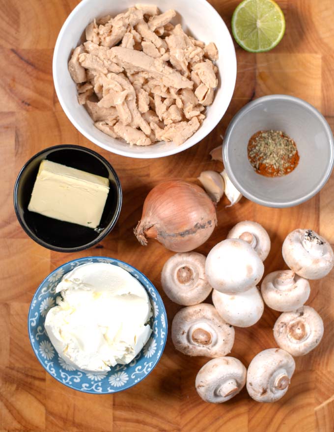 Ingredients needed to make Chicken Creme are collected on a board.