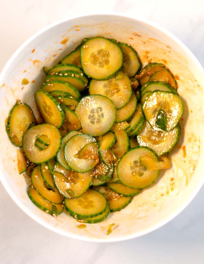 Top view of Korean Spicy Cucumbers in a bowl.