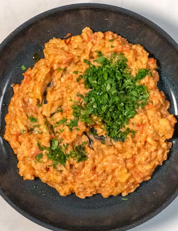 Free herbs are given into the mashed Zaalouk.