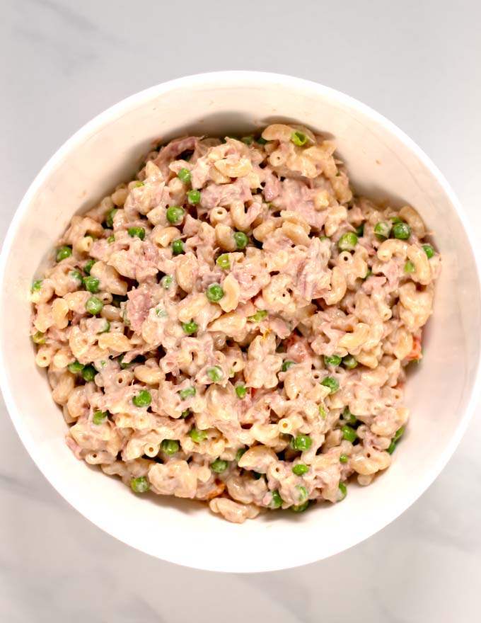 Top view of a while bowl with Cold Tuna Noodle Casserole.