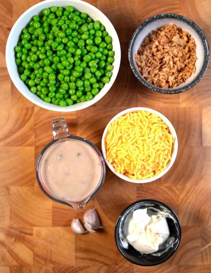 Ingredients needed to make Sweet Pea Casserole collected on a board.