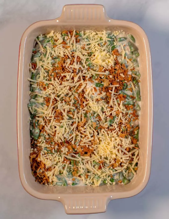 A top view of a baking dish with Green Bean Casserole with Cream Cheese before baking.