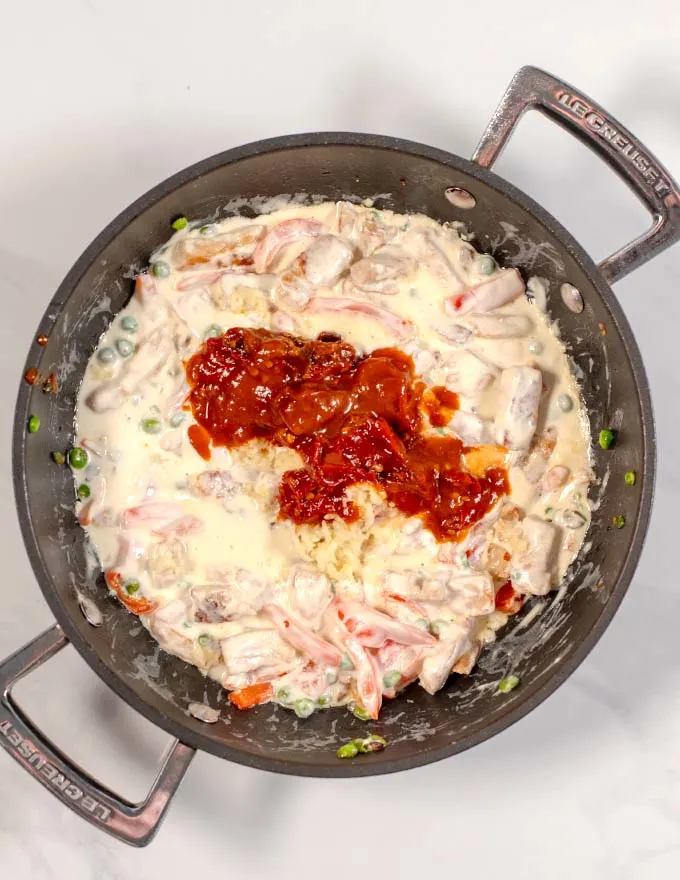 Chipotle peppers with adobo sauce is added to the creamy sauce.