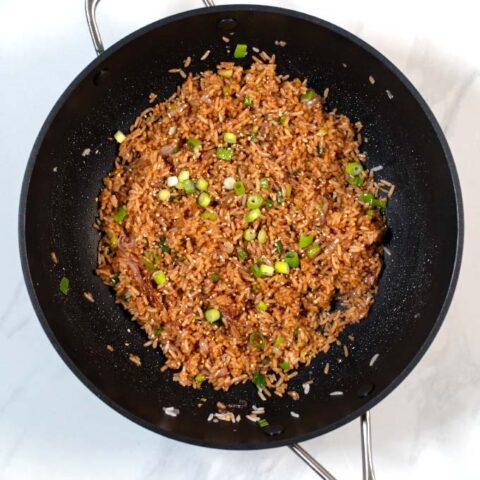 Fresh scallions are used to garnish Wasabi Fried Rice.