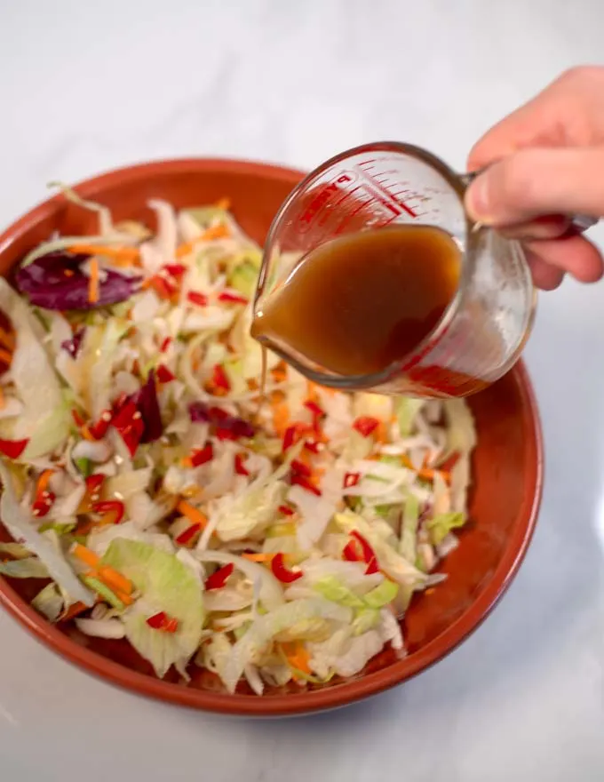 Thai Ginger Dressing is poured over a crunchy salad.