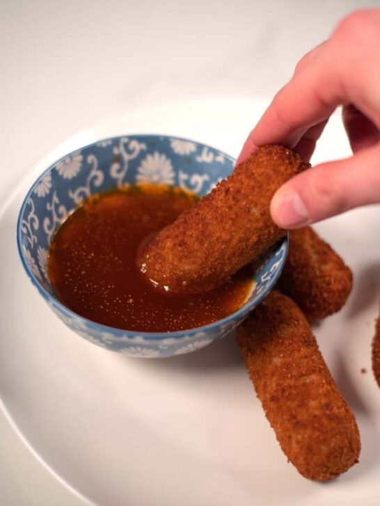 Dipping snacks into Bloves Sauce.