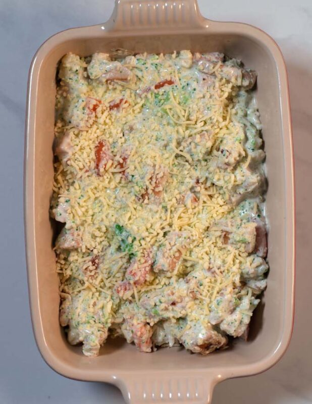 Keto Chicken Vegetable Casserole topped with cheese before baking.