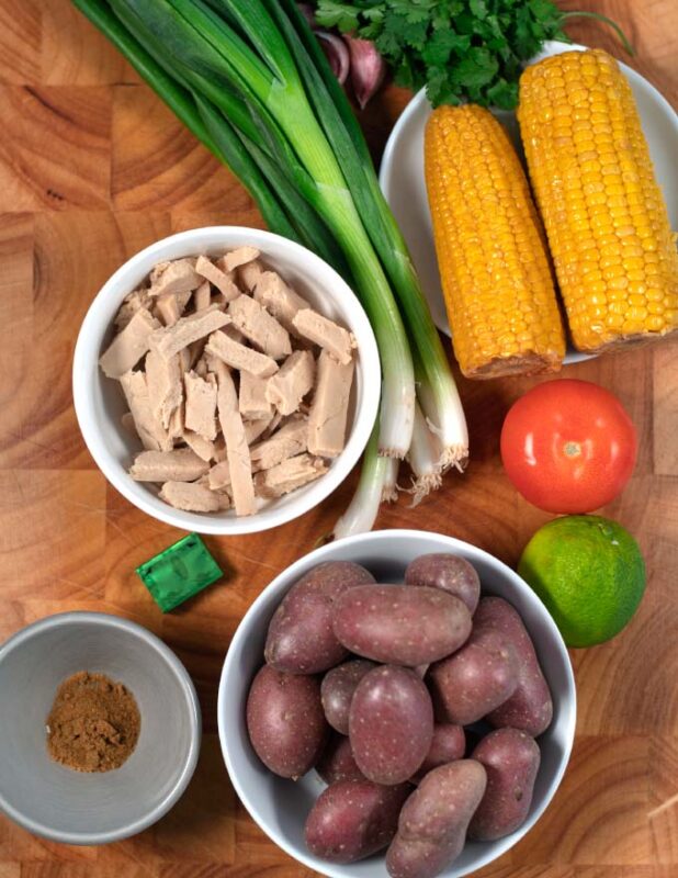 Ingredients needed to make Sancocho are collected on a board.