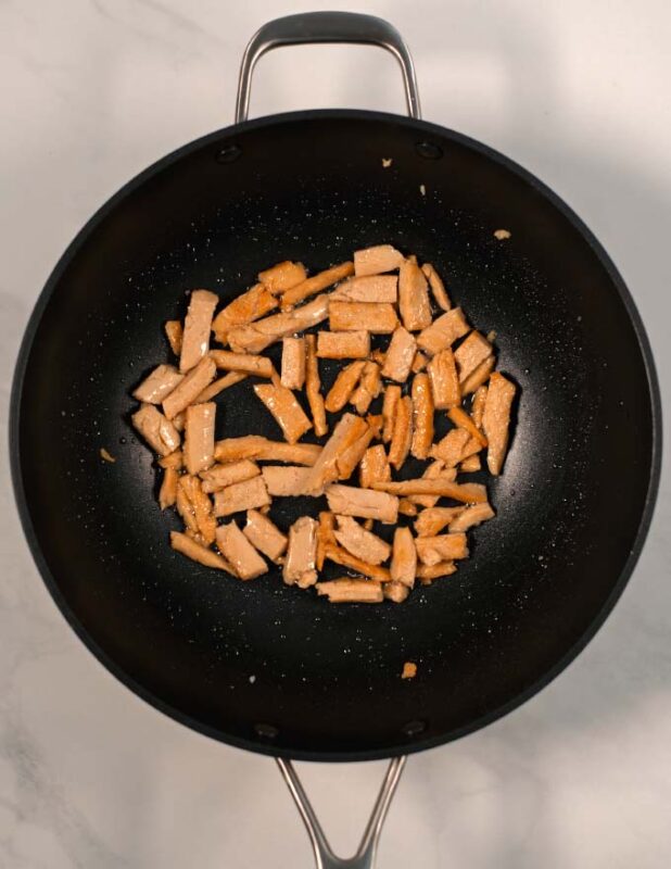 Vegan chicken is cooked in a pan.