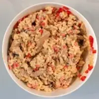 Combined Chicken Macaroni in a white bowl.