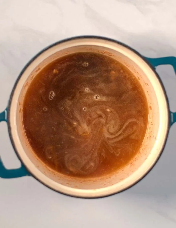 Vegetable broth base in a pot.
