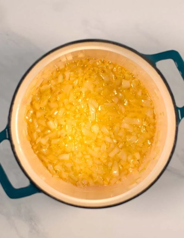 Finely diced onions are cooked in butter.