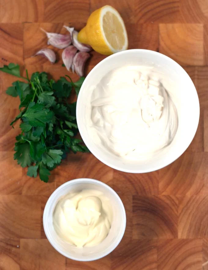 Ingredients needed to make Shawarama Sauce collected on a board.