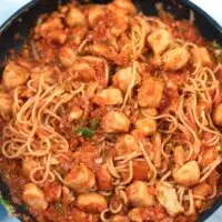 Fully mixed Jambalaya Pasta in a large frying pan ready for serving.