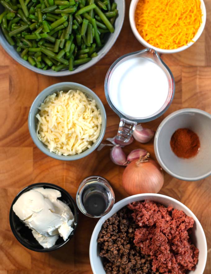 Ingredients needed to make a Keto Green Bean Hamburger Casserole are collected before preparation.