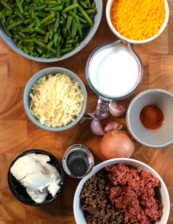 Ingredients needed to make a Keto Green Bean Hamburger Casserole are collected before preparation.
