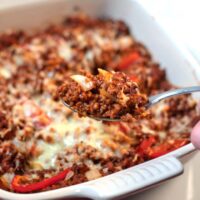 A spponful of Keto Sloppy Joe Casserole is lifted from the baking dish.