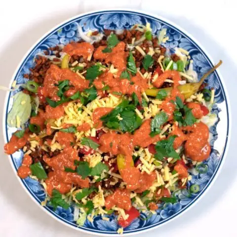 Keto Taco Salad topped with dressing/