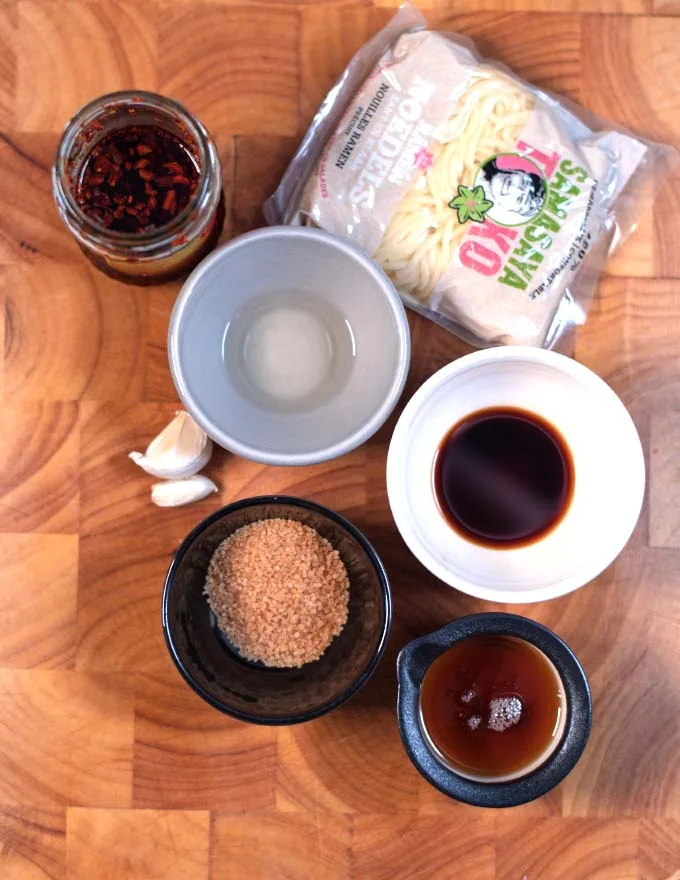 Ingredients needed to make Ramen Noodle Sauce collected on a board.