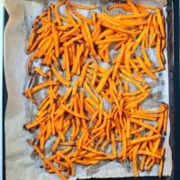 Crispy Sweet Potato Fries out of the oven after baking.