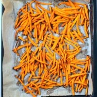 Crispy Sweet Potato Fries out of the oven after baking.
