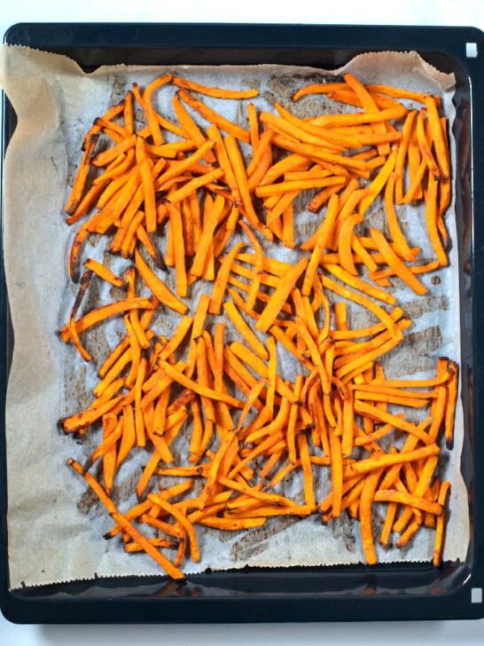 Crispy Sweet Potato Fries out of the oven after baking.