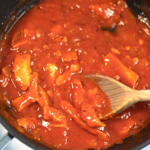 Closeup on vegan chicken bites in the sauce.