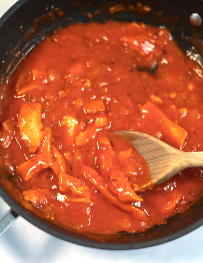 Closeup on vegan chicken bites in the sauce.