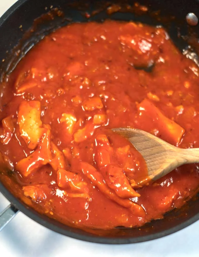 Closeup on vegan chicken bites in the sauce.