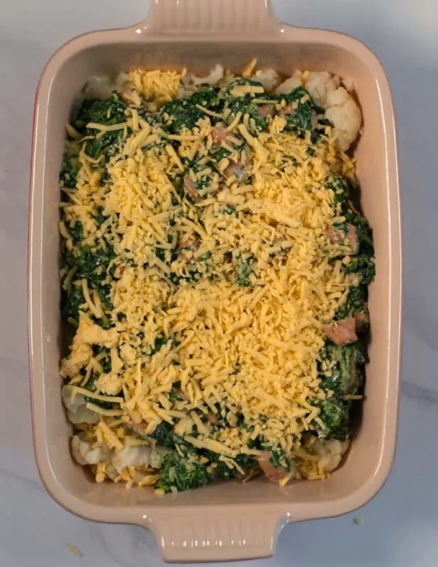 Cauliflower Sausage Casserole in a baking dish before baking in the oven.