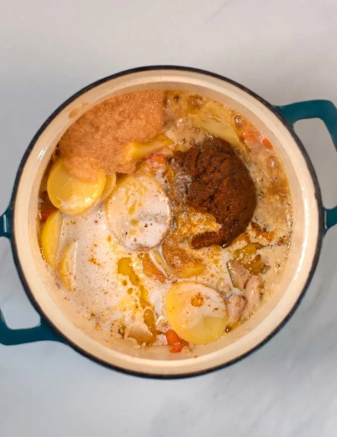 Coconut milk is adding creamy liquid texture.