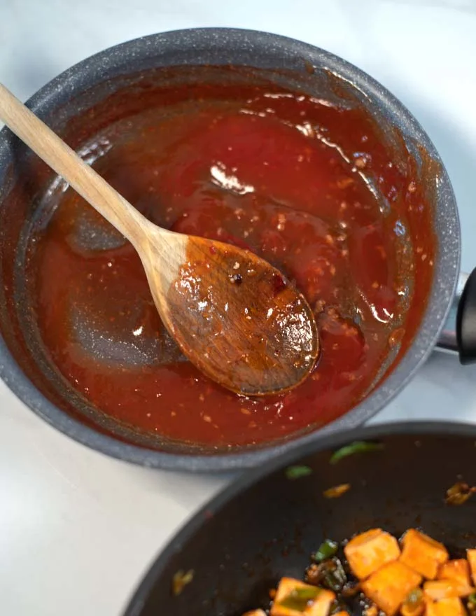 Filipino Barbecue Sauce and a wooden spoon.