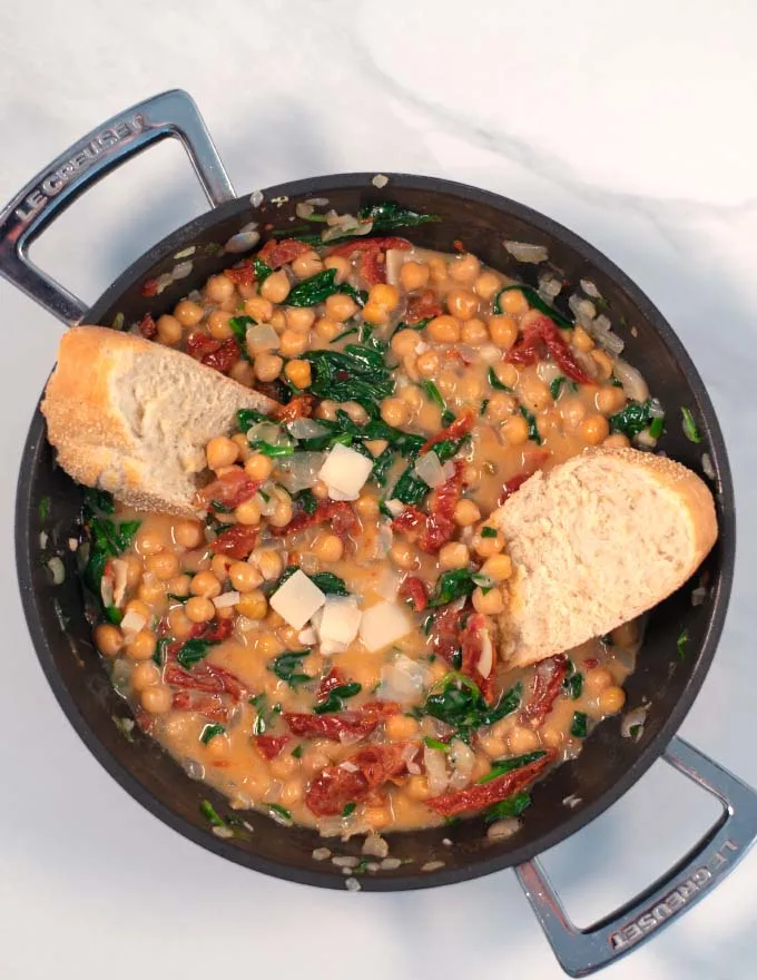 Fresh bread is dunked into Marry Me Chickpeas.