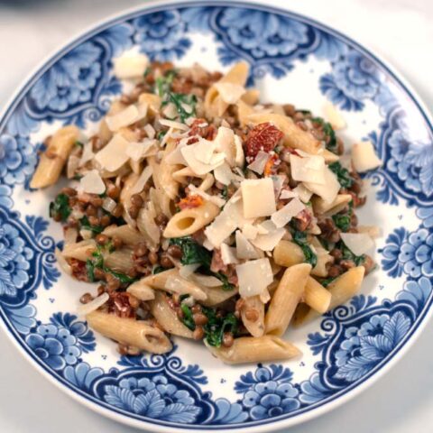 Fresh vegan parmesan flakes are used to top Marry Me Pasta.