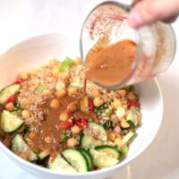 Dressing is poured over the Crispy Rice Salad.