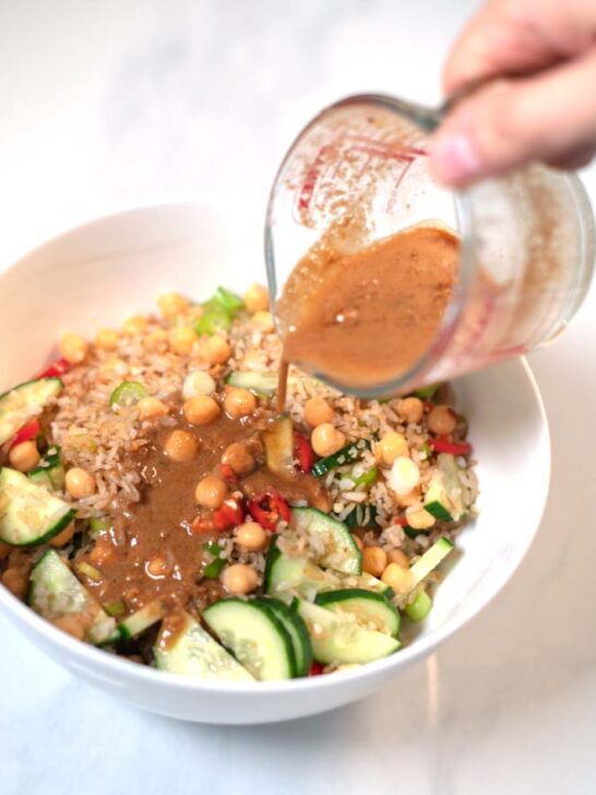 Dressing is poured over the Crispy Rice Salad.