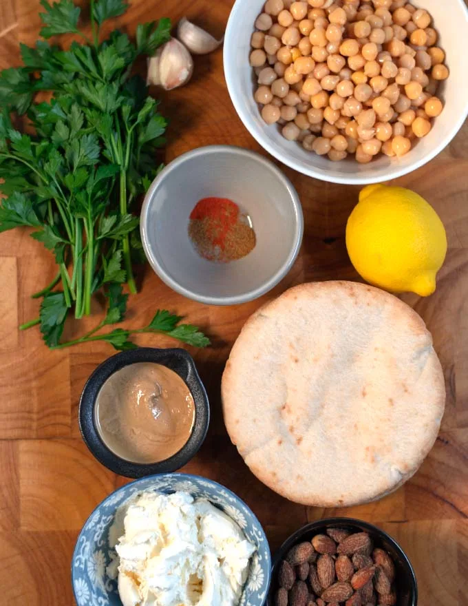 Ingredients needed to make Fatteh on a board.