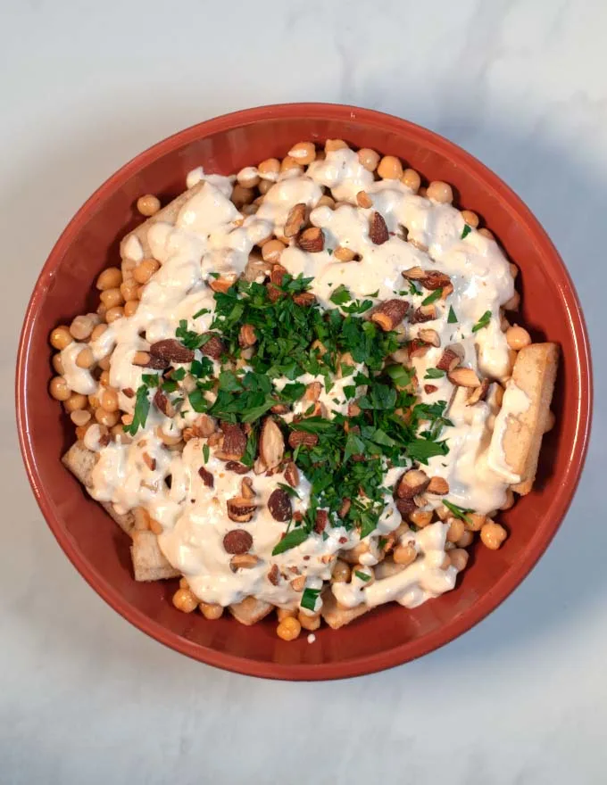 Finally the Fatteh is completeted with fresh parsley.
