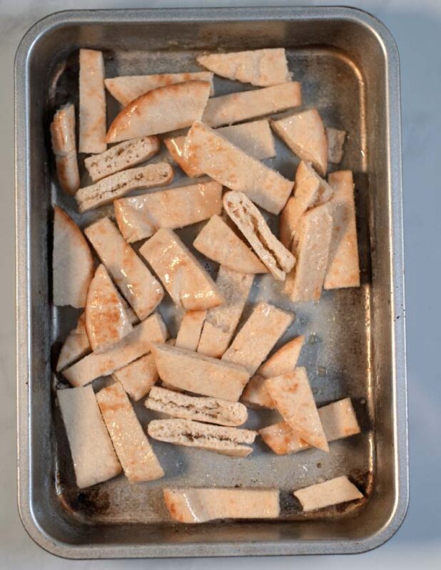 Cut pita bread is toasted.