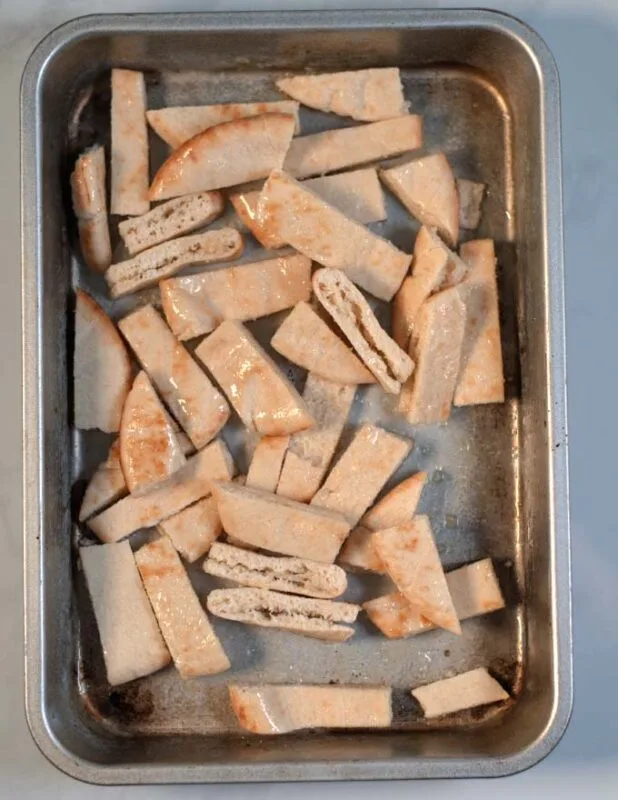 Cut pita bread is toasted.