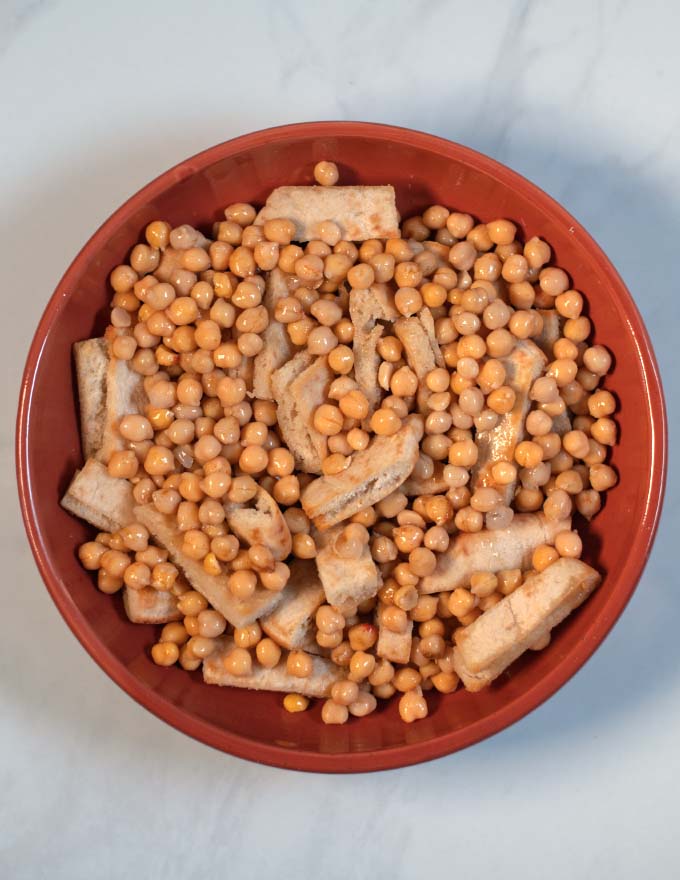 Chickpeas are added next to the Fatteh.