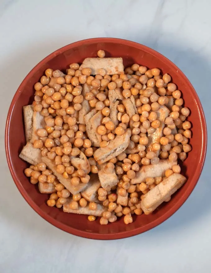 Chickpeas are added next to the Fatteh.