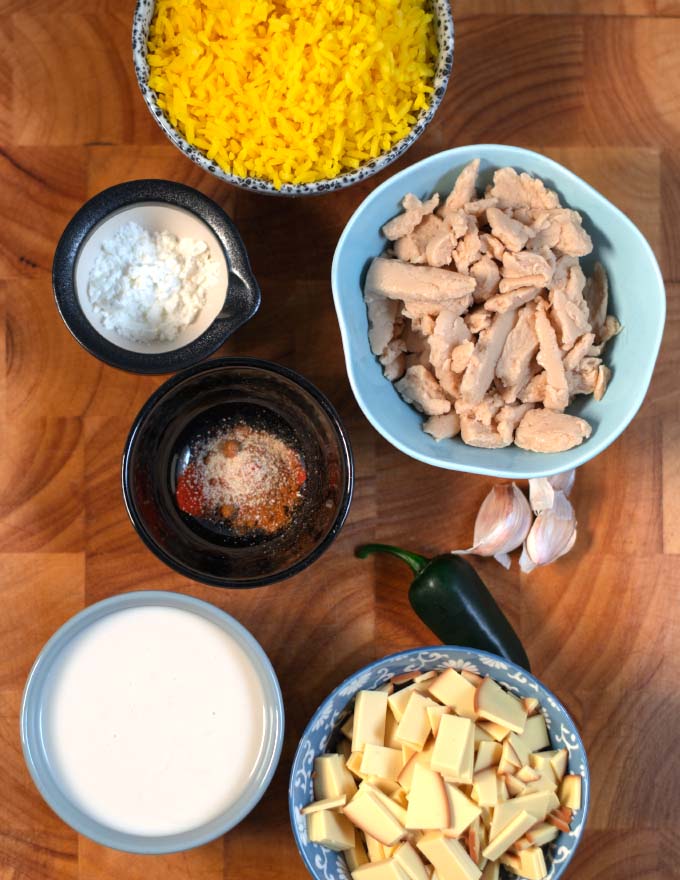 Ingredients needed to make Pollo Loco collected on a cutting board.