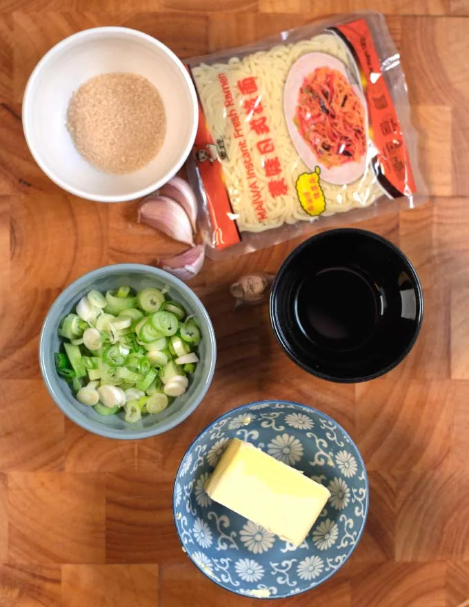 Ingredients needed to make Hibachi Noodles collected on a wooden board.