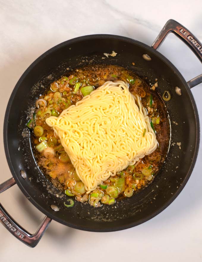 Instant noodles are mixed with the Hibachi sauce.